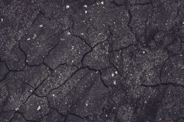 A black and white image of a cracked surface.