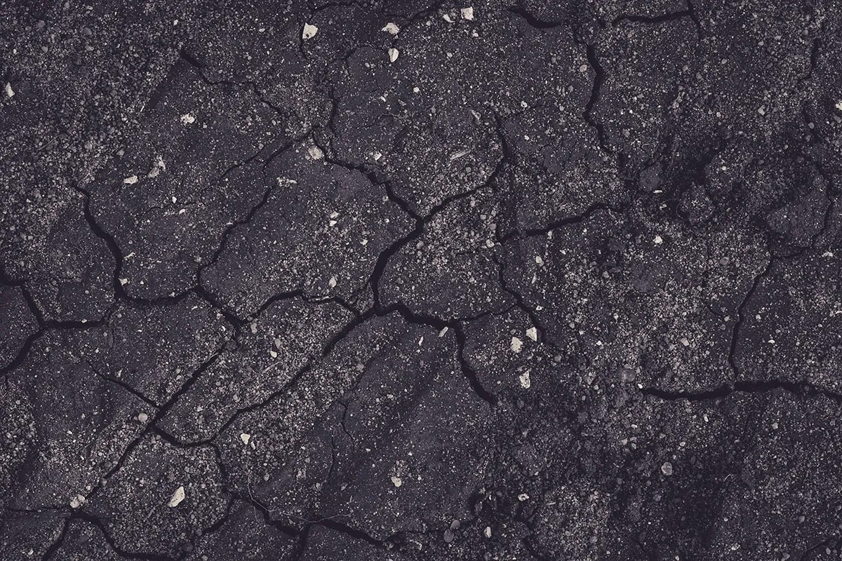 A black and white image of a cracked surface.